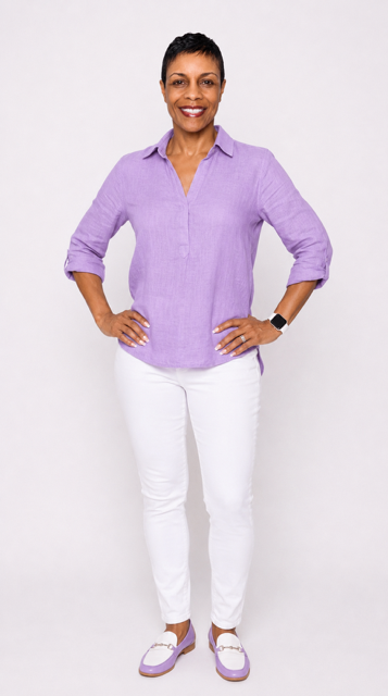 Jennifer Cornelius standing confidently in a lavender blouse